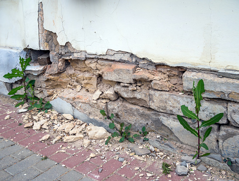 destruction of the foundation and wall of the building